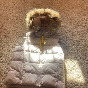 This is an adorable thick crème color vest from Gap!